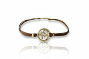 Bracelet with a gold symbol on a white background