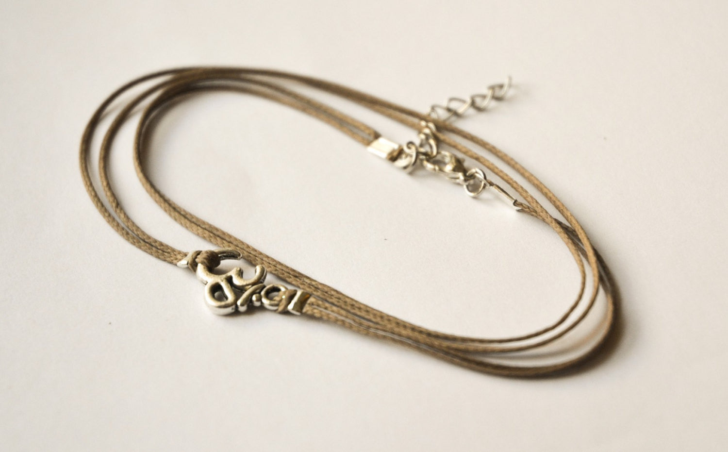 Om wrap anklet with brown cord - shani-adi-jewerly