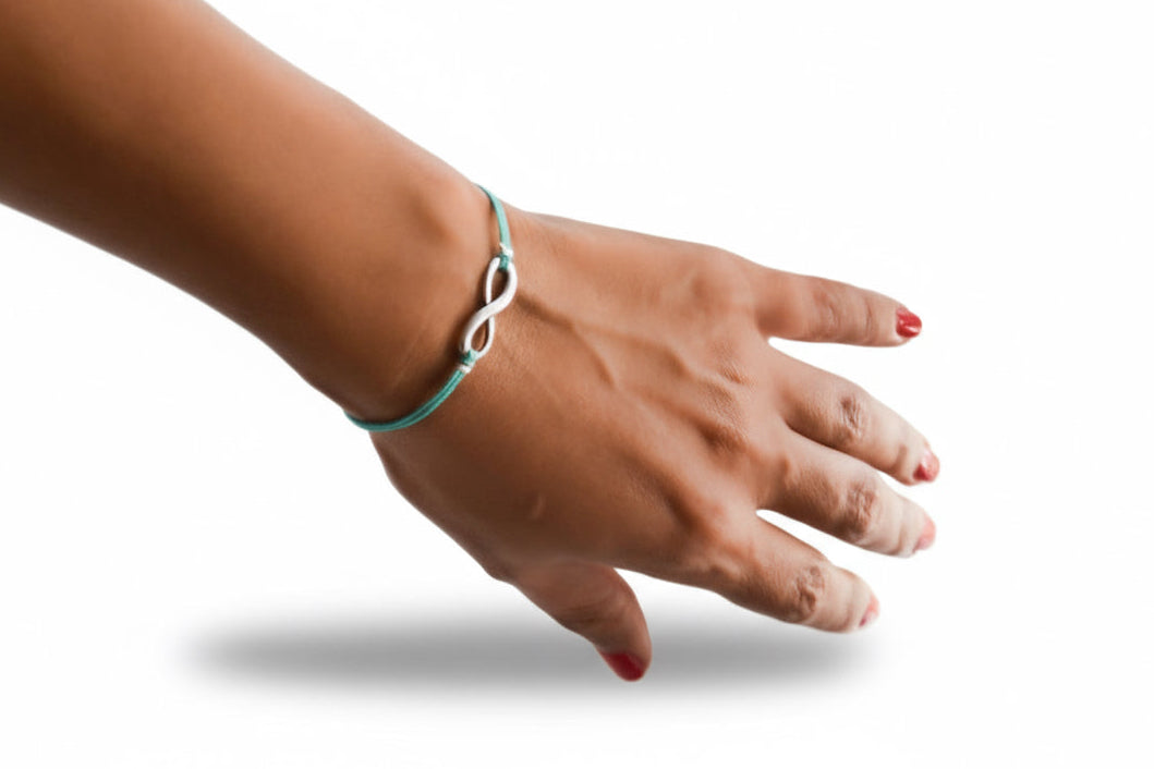 turquoise cord bracelet with a silver infinity charm - shani-adi-jewerly