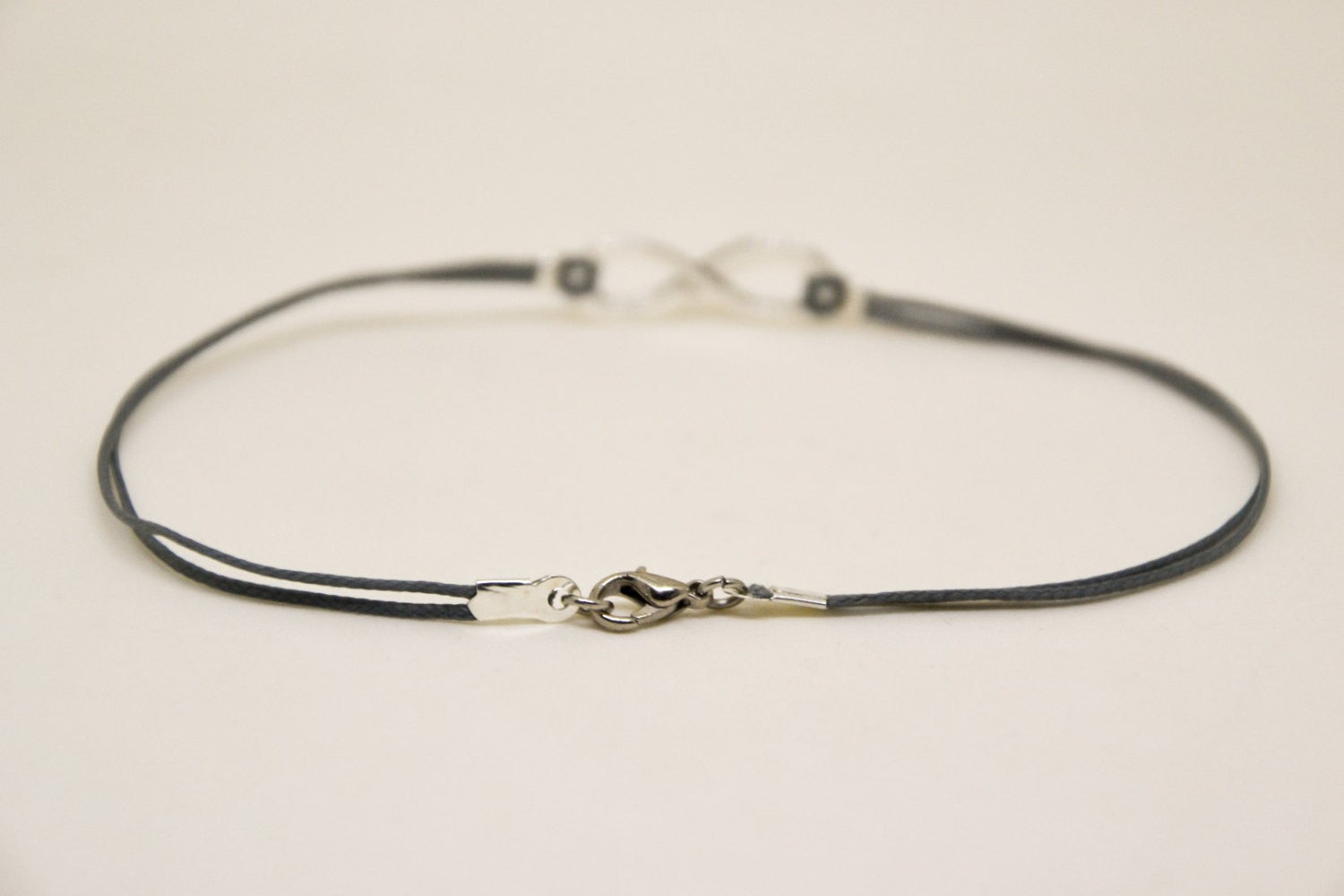 Men's anklet with a silver infinity charm and a gray cord - shani-adi-jewerly