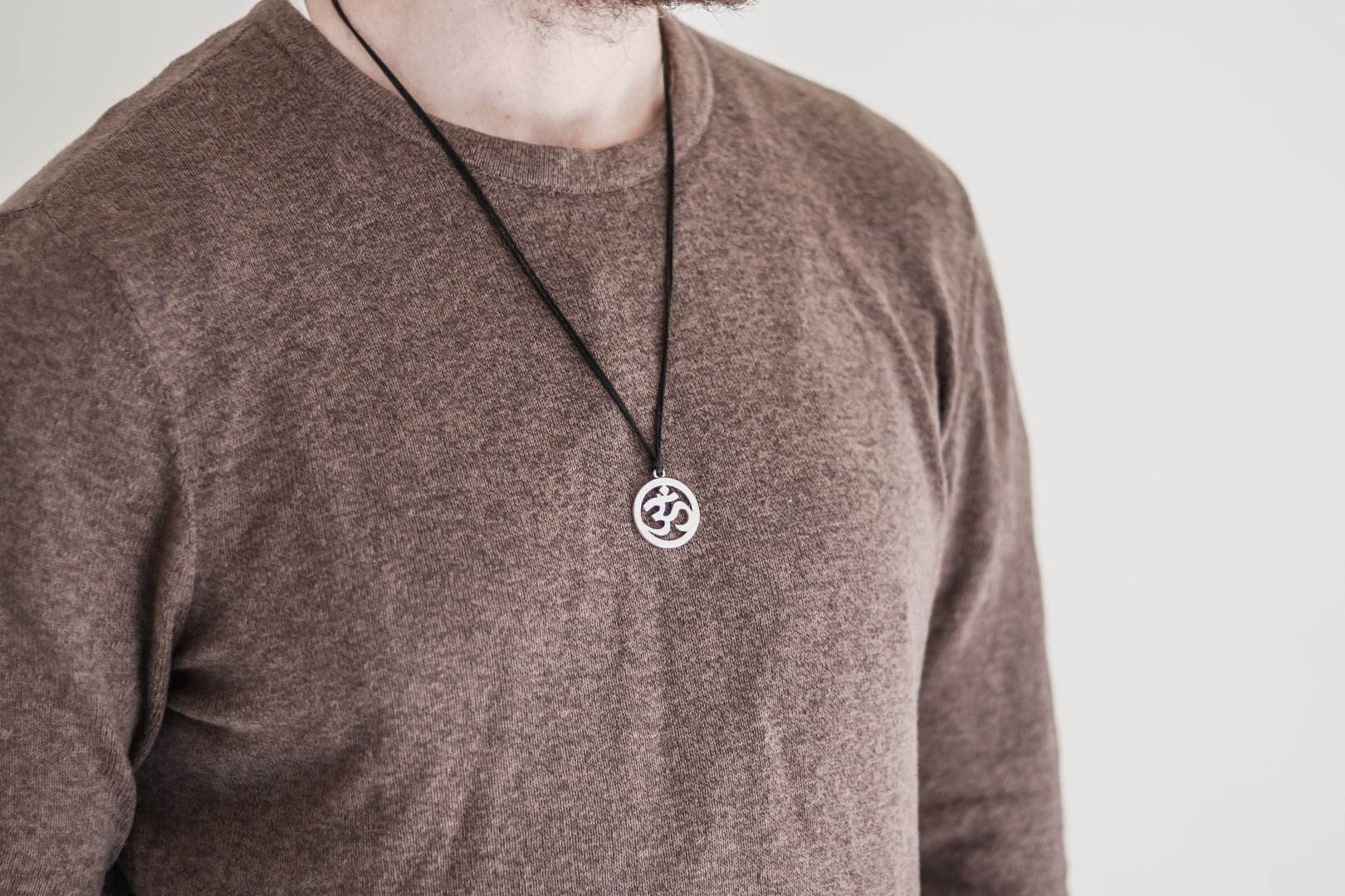 Men's necklace with a silver Om pendant, black cord - shani-adi-jewerly