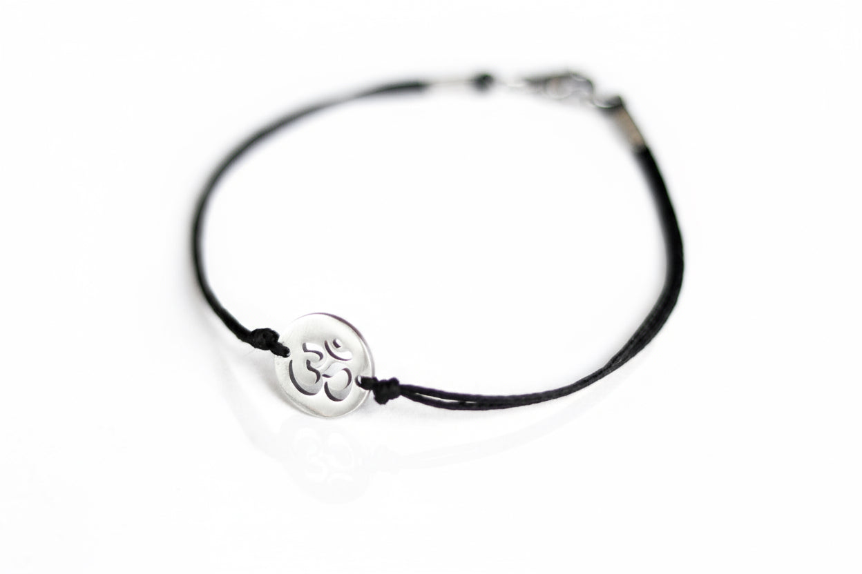 handmade silver om bracelet for women, black cord - shani and adi jewelry