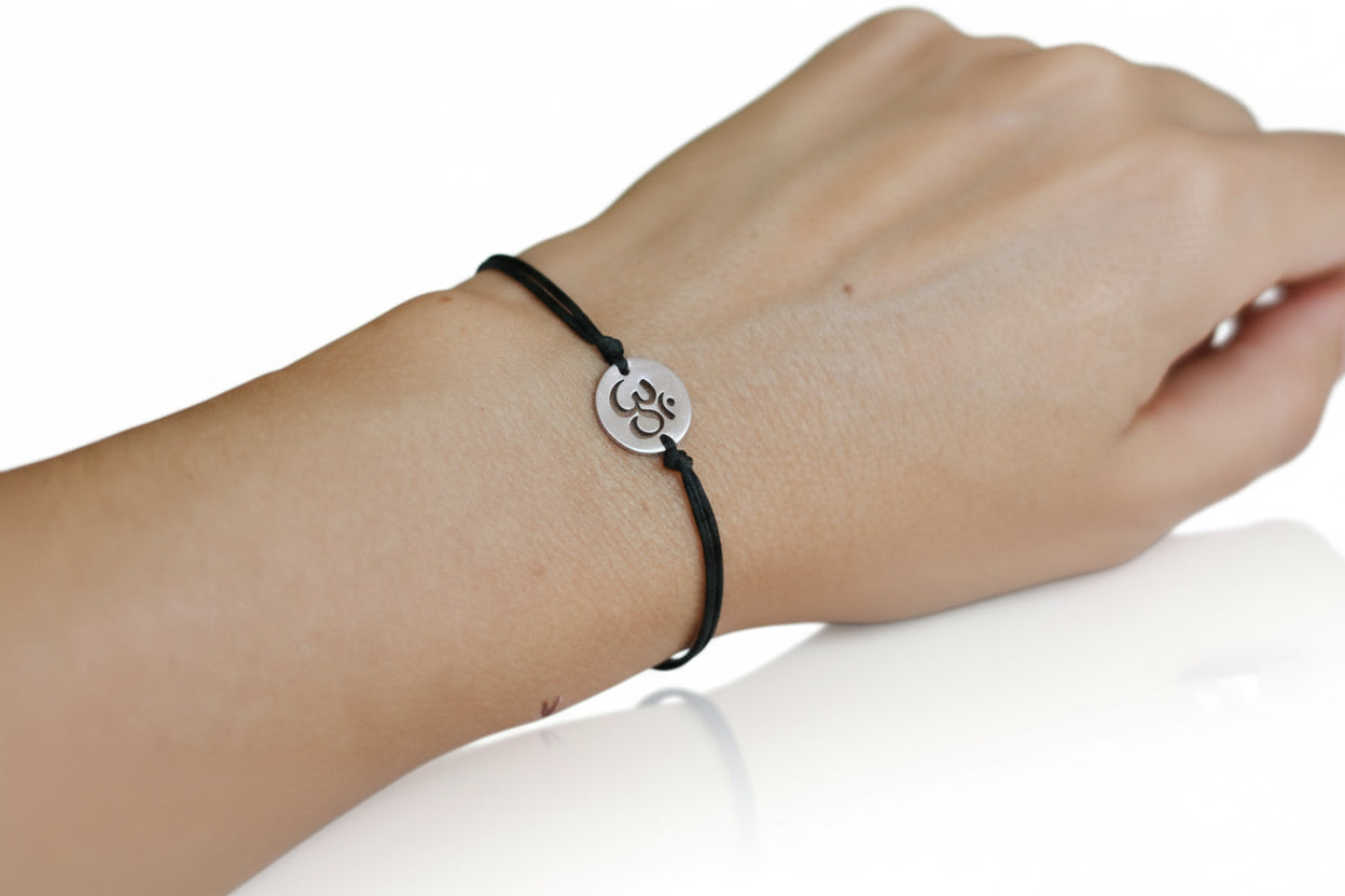 handmade silver om bracelet for women, black cord - shani and adi jewelry