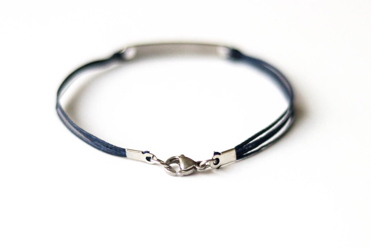 Bracelet with Hebrew text am Israel chai עם ישראל חי on a white background