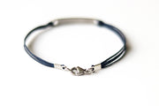 Bracelet with Hebrew text am Israel chai עם ישראל חי on a white background