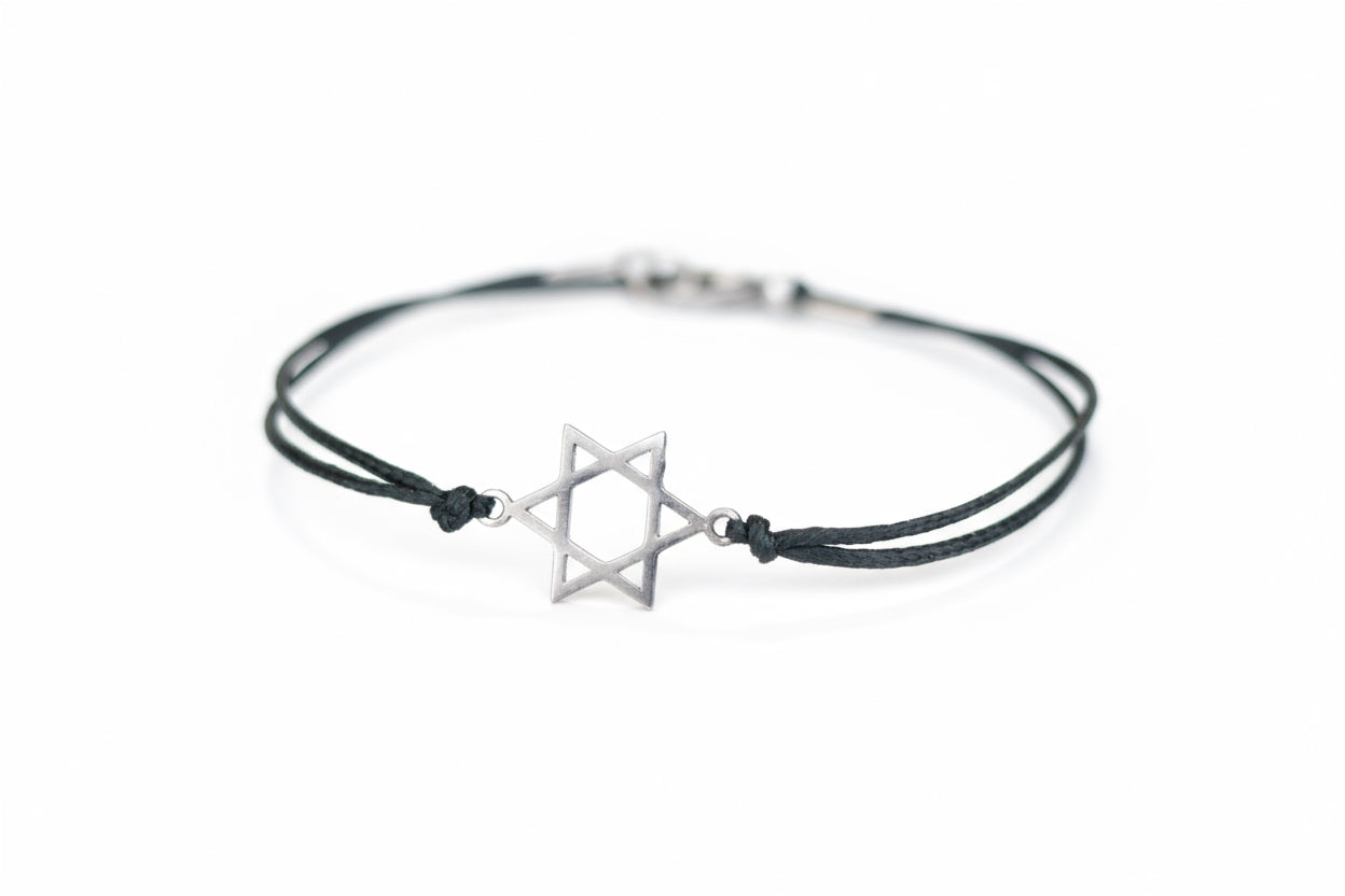 Bracelet with star-shaped charm on a wooden surface