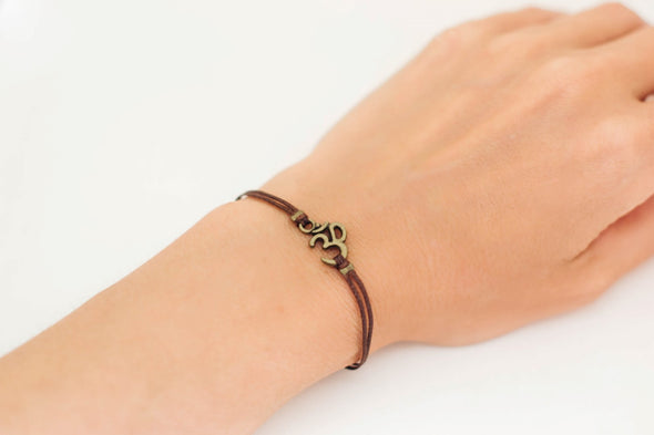 Brown cord bracelet with bronze tone Om charm, for her - shani-adi-jewerly