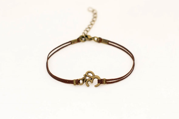 Brown cord bracelet with bronze tone Om charm, for her - shani-adi-jewerly