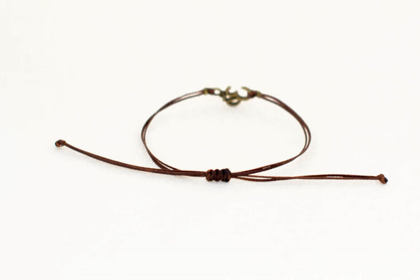 Men's bracelet with bronze Om charm, brown cord - shani-adi-jewerly