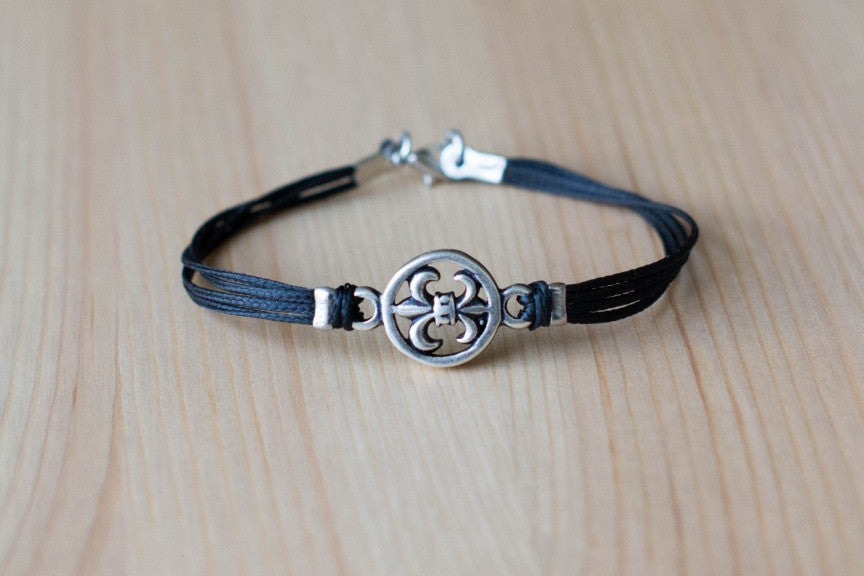 Silver Fleur de lis bracelet for men, black cord - shani-adi-jewerly