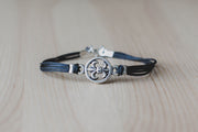 Silver Fleur de lis bracelet for men, black cord - shani-adi-jewerly
