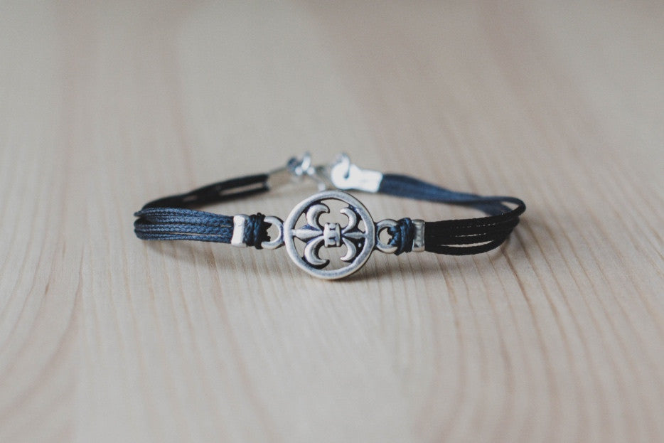 Silver Fleur de lis bracelet for men, black cord - shani-adi-jewerly