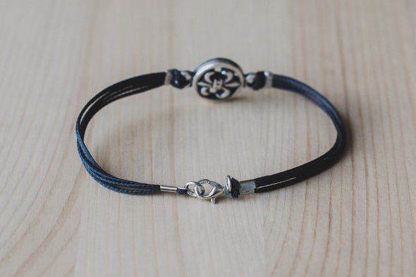 Silver Fleur de lis bracelet for men, black cord - shani-adi-jewerly