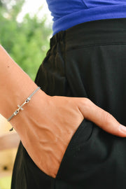 Women bracelet with silver cross charm, Gray cord - shani-adi-jewerly