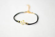 Women's bracelet with gold tone outline cross charm, black cord - shani-adi-jewerly