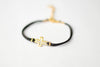 Women's bracelet with gold tone outline cross charm, black cord - shani-adi-jewerly