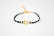 Women's bracelet with gold tone outline cross charm, black cord - shani-adi-jewerly