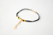 Women's bracelet with gold tone outline cross charm, black cord - shani-adi-jewerly