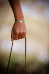 Turquoise cord bracelet with gold endless knot charm - shani-adi-jewerly