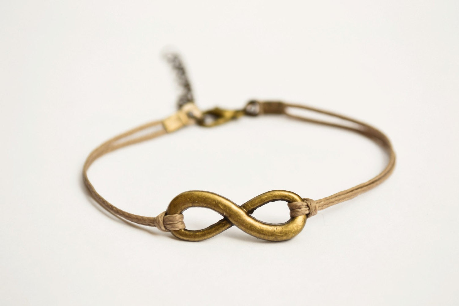 Brown cord bracelet with a bronze endless charm - shani-adi-jewerly