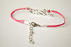 Pink cord bracelet with a silver love charm - shani-adi-jewerly