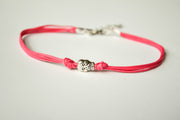 Pink cord bracelet with a silver skull charm - shani-adi-jewerly
