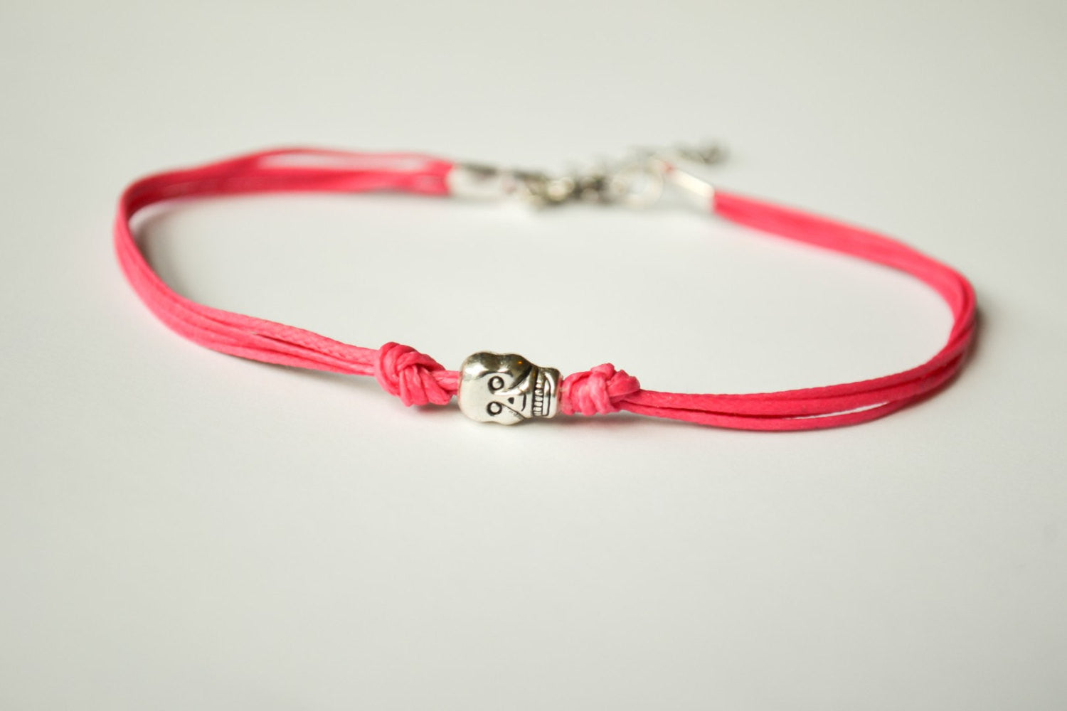 Pink cord bracelet with a silver skull charm - shani-adi-jewerly