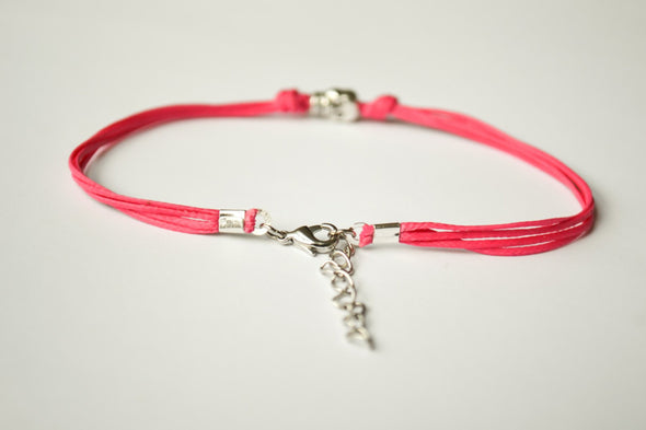 Pink cord bracelet with a silver skull charm - shani-adi-jewerly