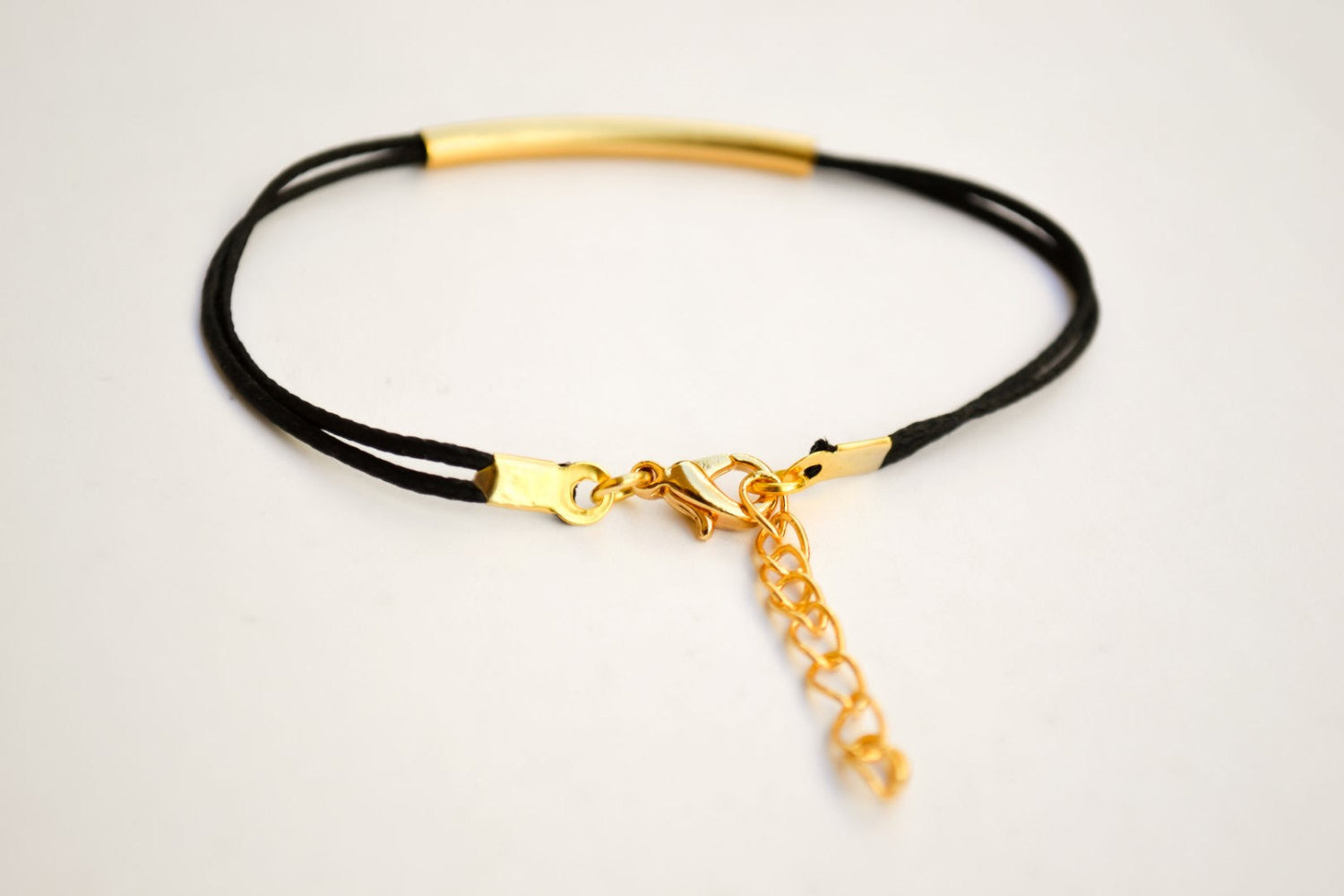 Gold bar bracelet, black cord - shani-adi-jewerly