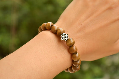 Wood beads stretch bracele with silver celtic endless knot charm - shani-adi-jewerly