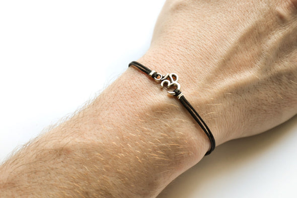 Om bracelet for men, black cord - shani-adi-jewerly
