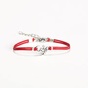 Women bracelet with Tibetan silver Om charm, red cord - shani-adi-jewerly