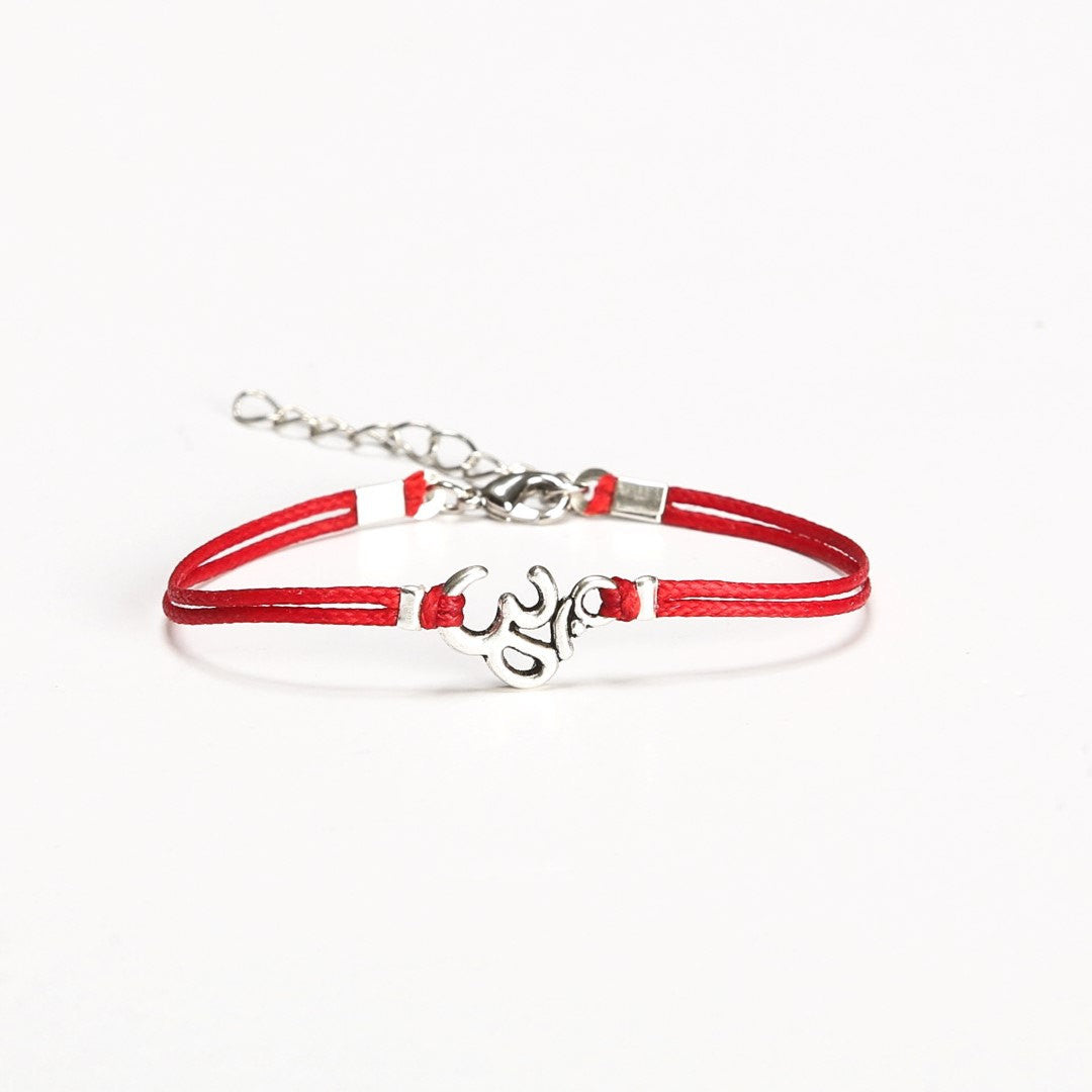 Women bracelet with Tibetan silver Om charm, red cord - shani-adi-jewerly