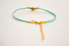 Turquoise bracelet with gold tone Om charm - shani-adi-jewerly