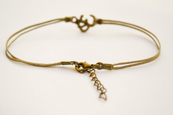 Brown cord anklet with bronze tone Om charm - shani-adi-jewerly