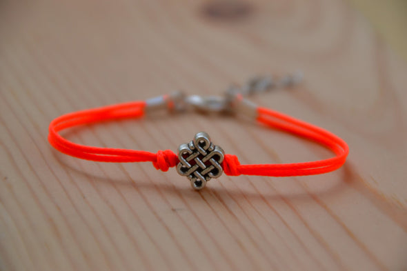 Bright peach cord bracelet with a silver endless knot bead - shani-adi-jewerly