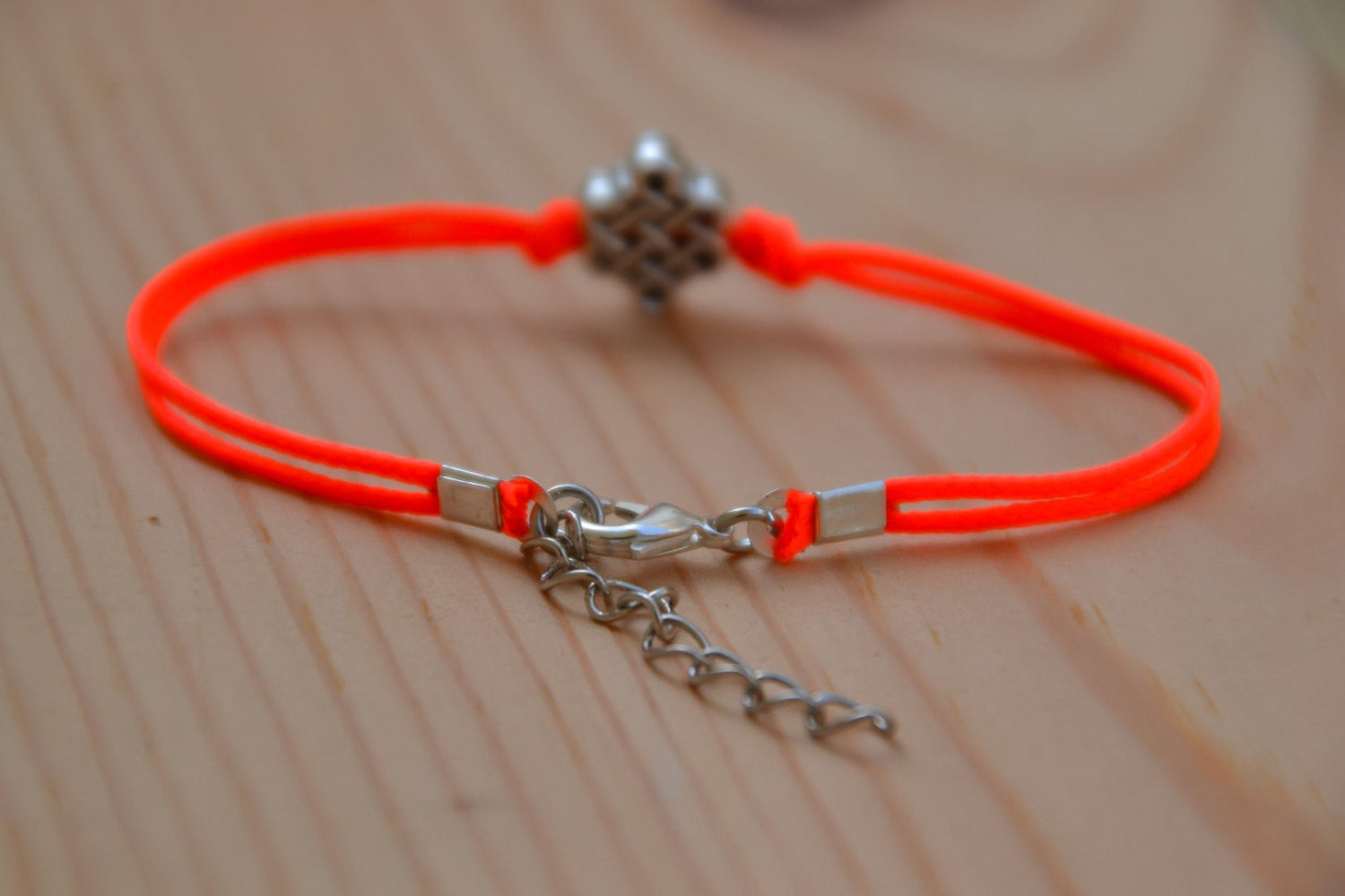 Bright peach cord bracelet with a silver endless knot bead - shani-adi-jewerly