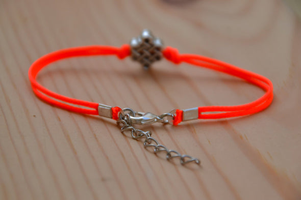 Bright peach cord bracelet with a silver endless knot bead - shani-adi-jewerly