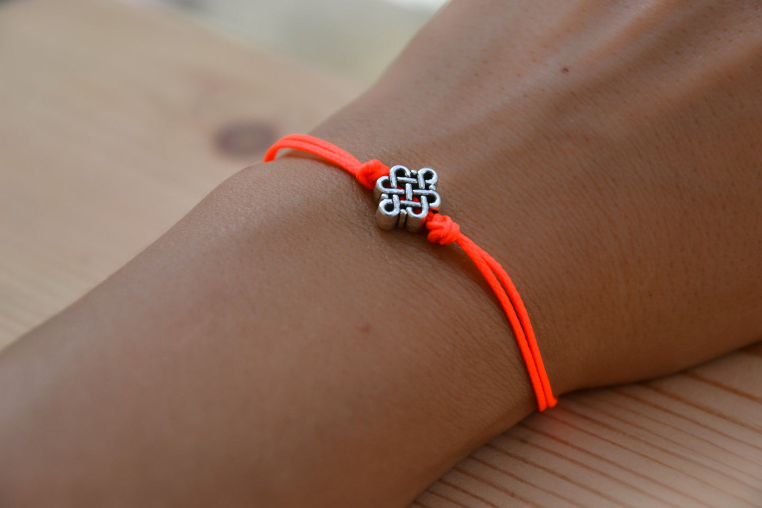 Bright peach cord bracelet with a silver endless knot bead - shani-adi-jewerly