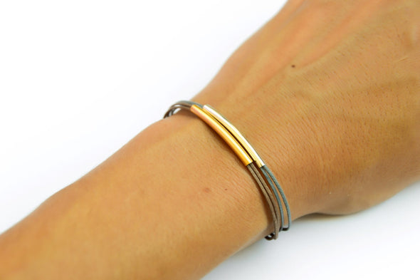 Silver and gold plated tube charms bracelets, gray and brown cords - shani-adi-jewerly