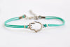 Turquoise cord bracelet with a silver hamsa charm - shani-adi-jewerly