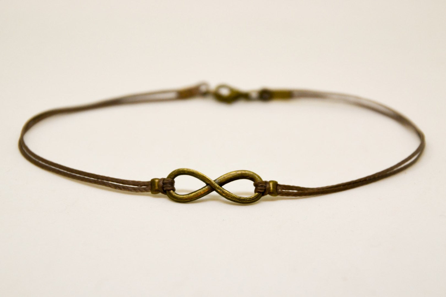 Men's anklet with a bronze infinity charm and a brown cord - shani-adi-jewerly