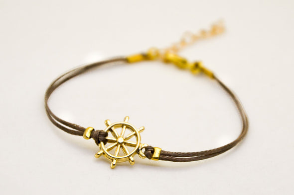 Brown cord bracelet with a 14k gold plated Ship wheel charm - shani-adi-jewerly