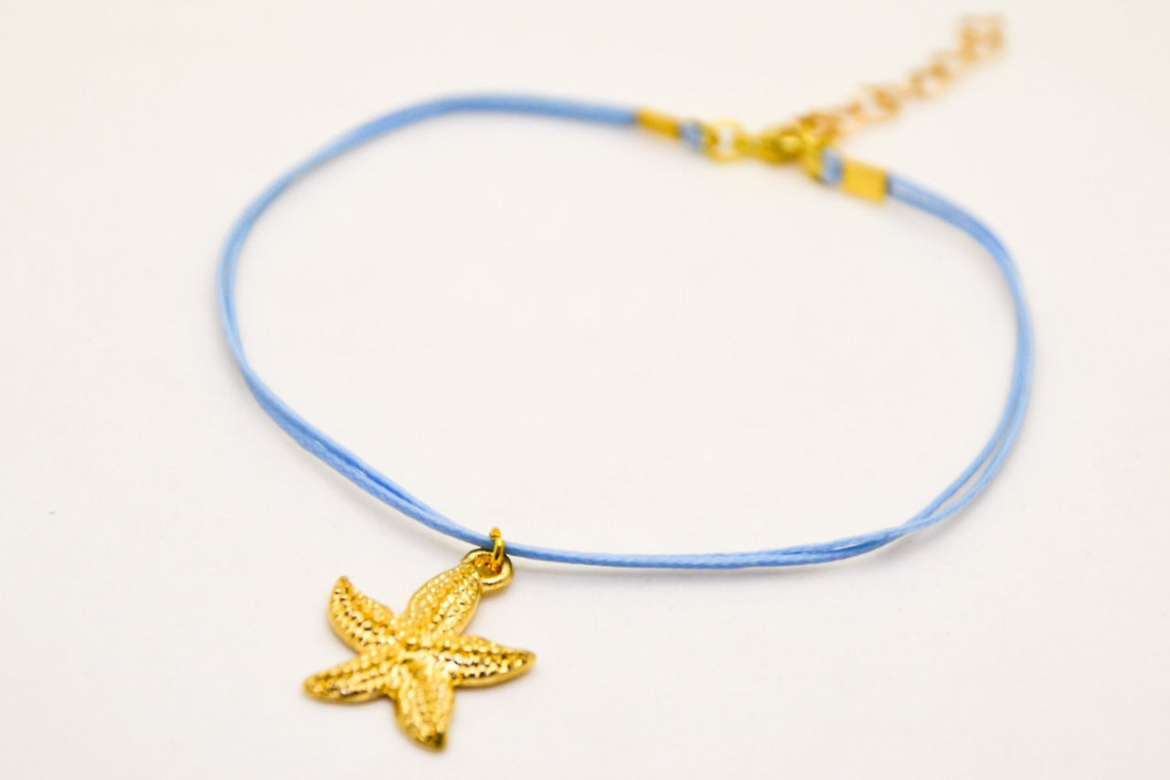 Ankle bracelet with a gold plated starfish dangle charm, blue cord - shani-adi-jewerly