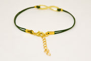 Green cord bracelet with a gold tone infinity charm - shani-adi-jewerly