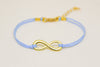 Gold infinity bracelet, womens bracelet with a blue cords, adjustable - shani-adi-jewerly