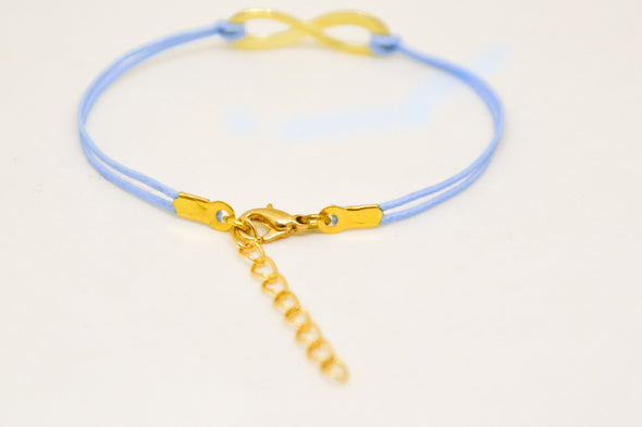 Gold infinity bracelet, womens bracelet with a blue cords, adjustable - shani-adi-jewerly