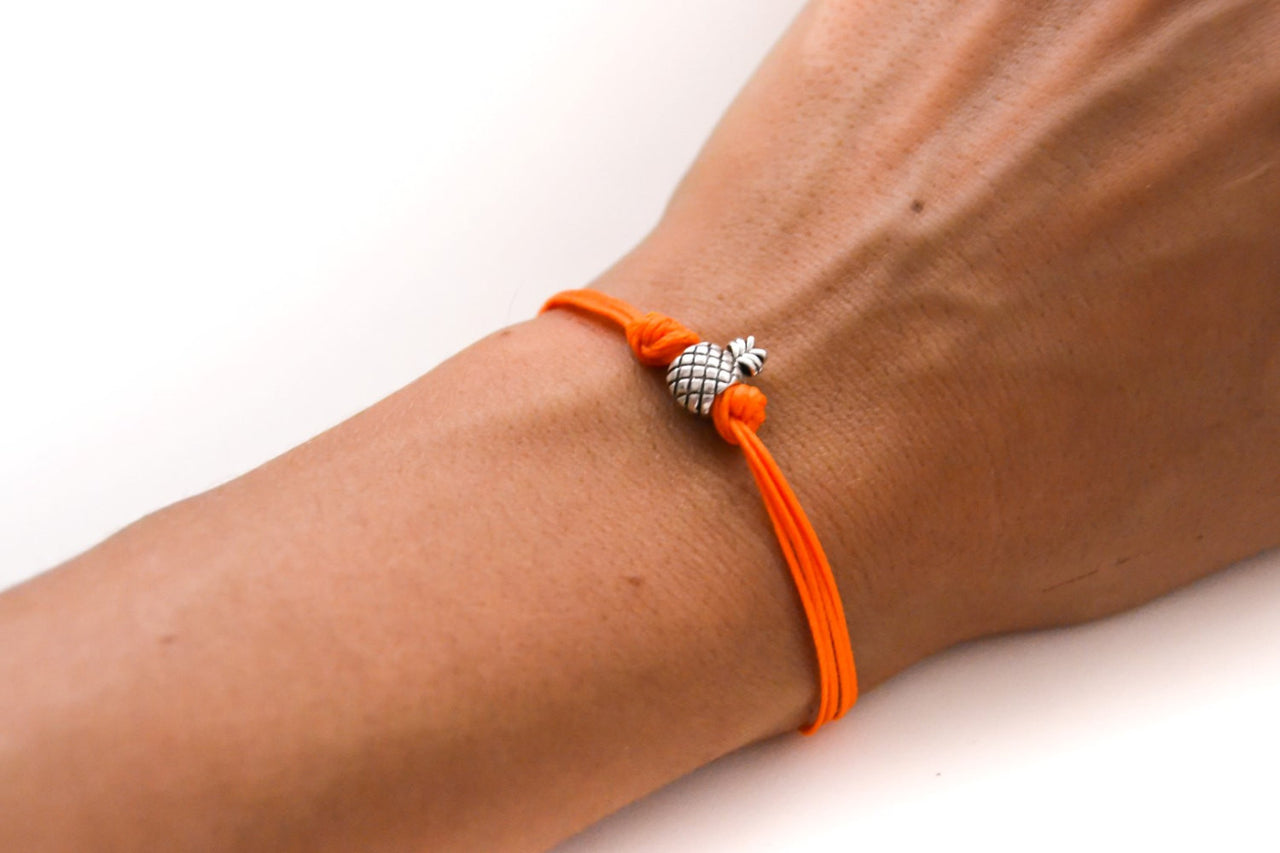 Orange cord bracelet with a silver pineapple charm - shani-adi-jewerly