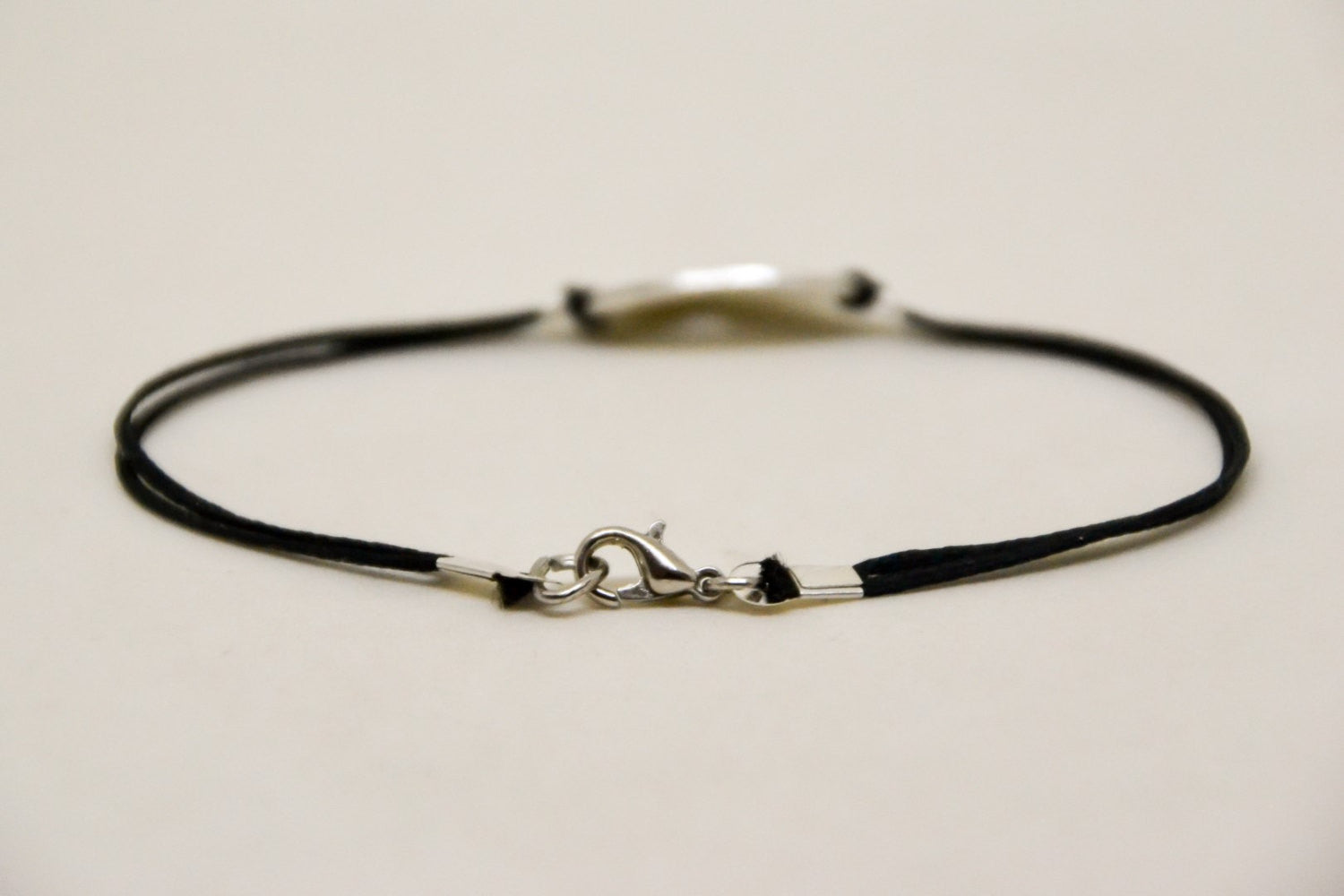 Silver cross bracelet for men, black cord - shani-adi-jewerly