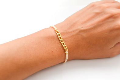 Beige cord bracelet with a gold plated flat chain charm - shani-adi-jewerly